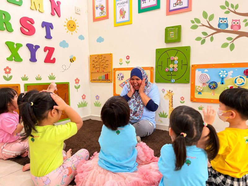 Children playing with a teacher in a RightStart classroom